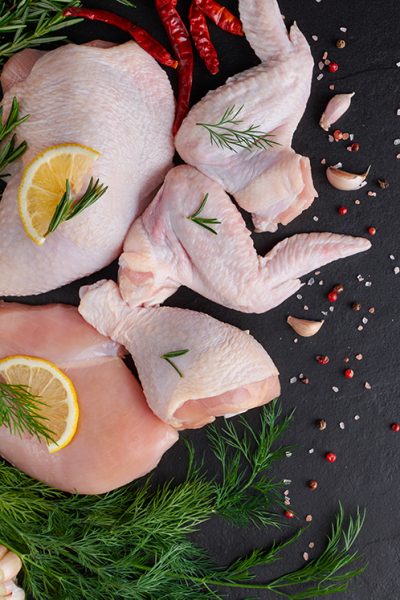 raw-chicken-fillet-with-garlic-pepper-and-rosemary-on-wooden-on-chopping-board 2